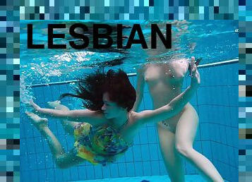 Two foxy lassies Liza and Alla fool around in the swimming pool