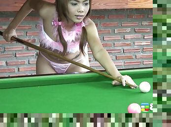 Glamorous babe from Southeast Asia goes naughty on the pool table