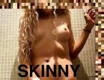 Beautiful skinny blonde squirts in the bathroom of the mall