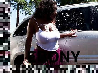 Curvaceous ebony goddess with massive tits rides on a white dick