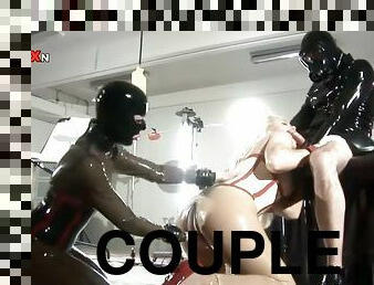 Latex-Clad Dominant Couple Having Fun with a Submissive Blonde