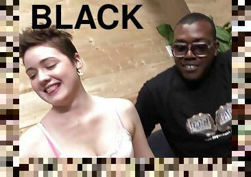 Emma Snow strokes and sucks two big black cocks in a backstage