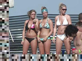 Pretty chicks in bikinis have fun at an outdoor party in reality clip