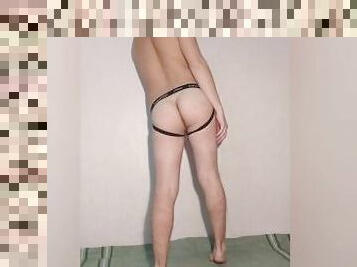 Young hot guy posing in sexy lingerie - jockstrap showing ass and ass