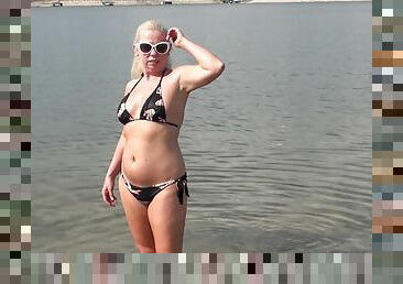 Solo wife Beth takes off her clothes to tease on a public beach