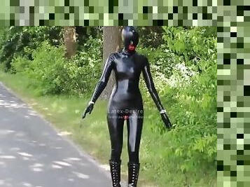 Living rubberdoll walks outdoor Latex