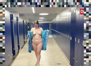 Nerdy babe swallows in the locker room