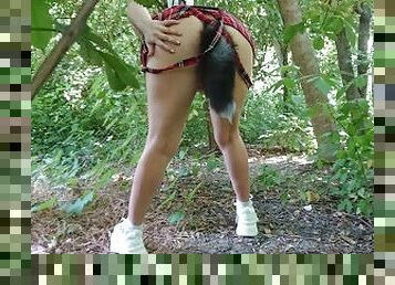 Skittish wolf girl with sexy legs masturbates in the shrub.