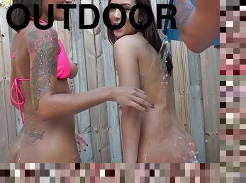 Naughty hardcore party outdoors with a pair of bikini sluts