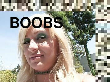 Fishnet-clad blonde with big boobs enjoying a hardcore gangbang