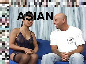 Lingerie wearing Asian masseuse giving a handjob to a white man