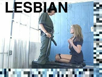 Lesbian jailbird gets fucked with a strap on dildo after pussy licking the guard
