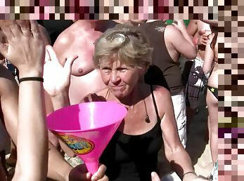 Doting amateur shows off her nice ass close up at a saucy beach party