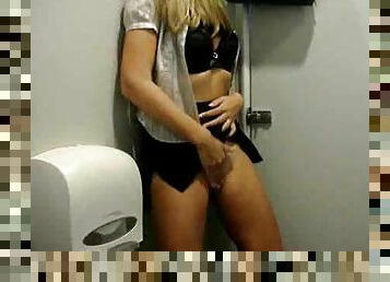 She rubs her cunt in a public bathroom