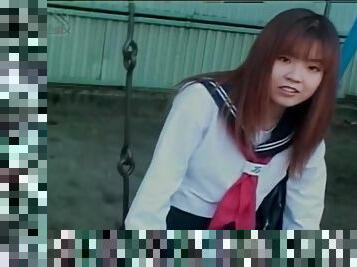 Schoolgirl upskirt on the swing set outdoors