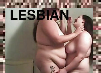 Two chubby brunette lesbians enjoy playing with each other's holes