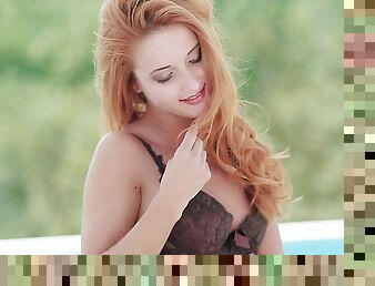 Beautiful redhead with perky tits touching her sexy body