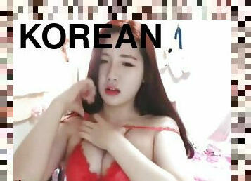 Korean teen bunny shows her round big tits