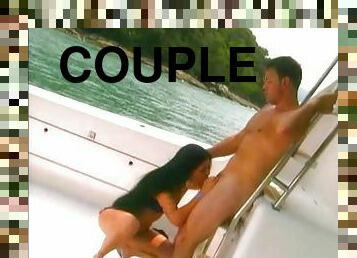 This wild couple gets naked and fucks on a boat on a lake