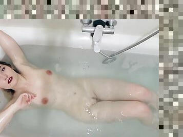 Busty emo chick invites us to join her in bath tub as she gets hot and horny