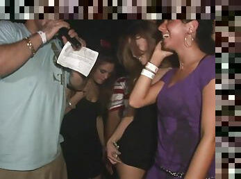 A few slutty chicks flash their butts in a club in voyeur video