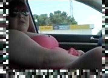 Obese skank wearing glasses rubs her twat in a car