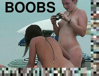 Nudists splash around in the water flashing asses and boobs