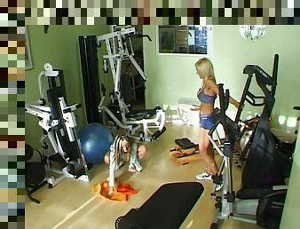 sporty lesbians with fake tits fuck using toys in the gym