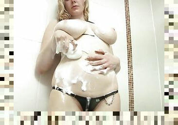 Curvy young whore takes a sensual shower for the camera