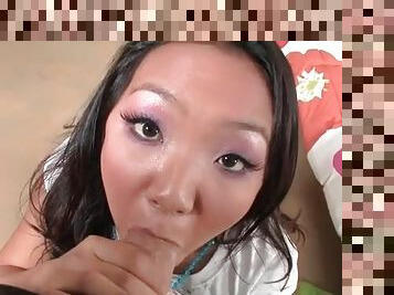 Asian gets on her knees and gives a blowjob