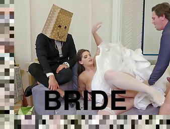 Bride spreads her legs in front of the wedding manager