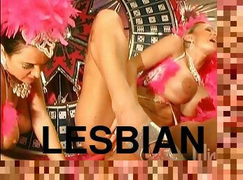 Sexy lesbians in a carnival outfit toy their wet pussies