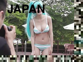 Japanese cosplaying babe with blue hair blows two guys at once