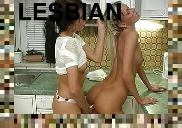 Lustful blonde and brunette enjoy steamy lesbian sex in the kitchen