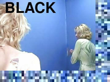 Two horny chicks get a big black cock out of a gloryhole