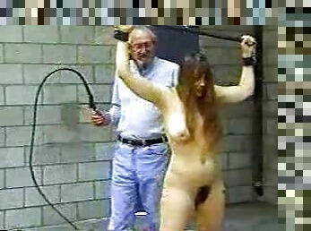 Old man whips a girl in bondage