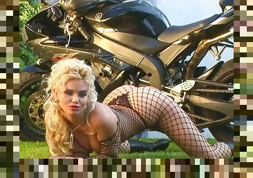 Naughty blonde chick poses next to her her husband's Yamaha R1