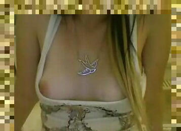 Webcam girl shows off her perky tits to everyone