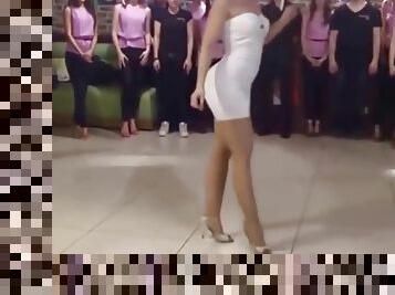 Woman in sexy short dress is dancing on family party