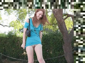 Redhead Lacie takes her panties off and walks in the street