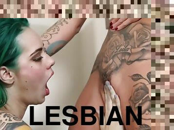 Blonde lesbian eats pussy and fingered tattooed babe
