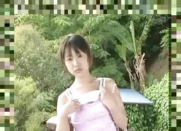 Teenage Japanese girl strips outdoors