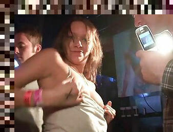 Crazy girls flash their bodies during a party in a club