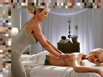 MILF and younger blonde in mutual oral passion down the massage table