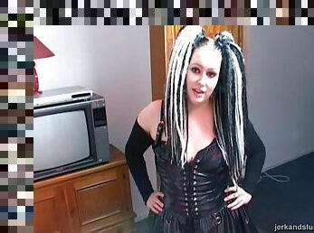 A wild goth girl with crazy hair shows off her handjob skills