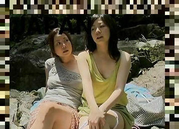 Two Japanese bitches enjoy licking each other's cunts outdoors