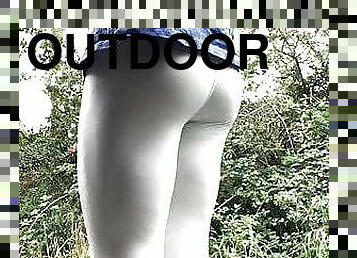 Cock in white leggings outdoors 