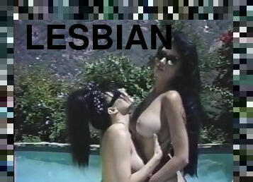 Two dark-haired lesbians go at it in a pool - Golden Age Media