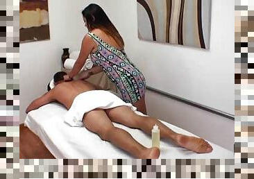 Curvy Asian masseuse rubs him down and rides his big dick