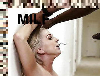 Sexy blonde MILF in lingerie blows a black stud